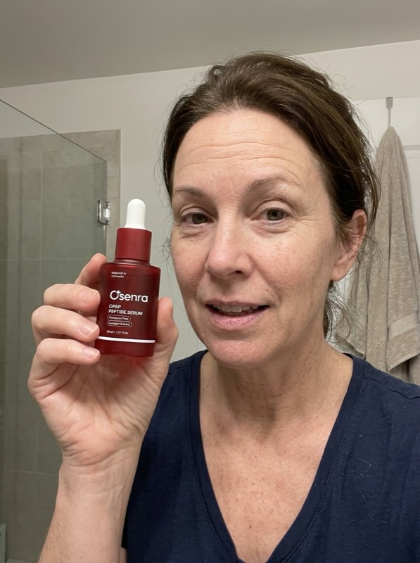 Osenra customer holding the CPAP Peptide Serum