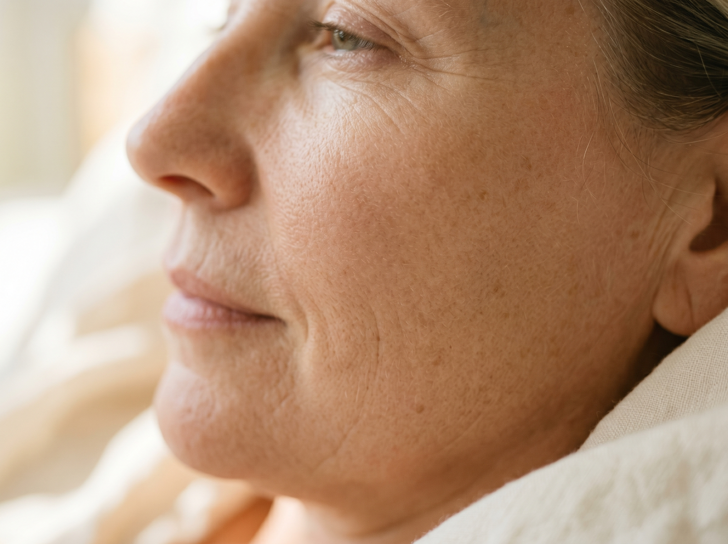 Mature skin in soft morning light, early phase