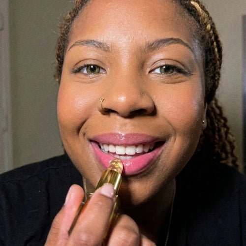 Customer applying Elara Color-Adapting Lipstick